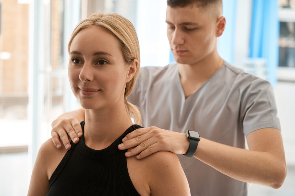 Nice young woman having a consultation with a chiropractor